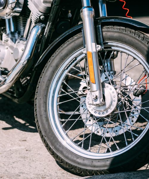 Motorcycle Front wheel and brake systems for motorcycles close up.